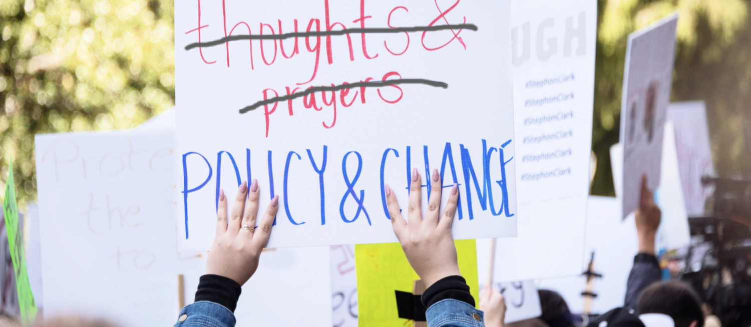 Photo of a protest sign that reads 