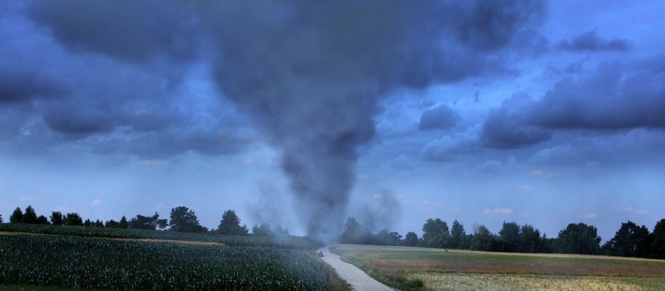 Photo of a tornado touching down in a rural area