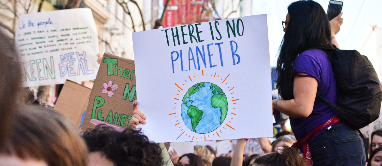 protesters holding a no planet B sign