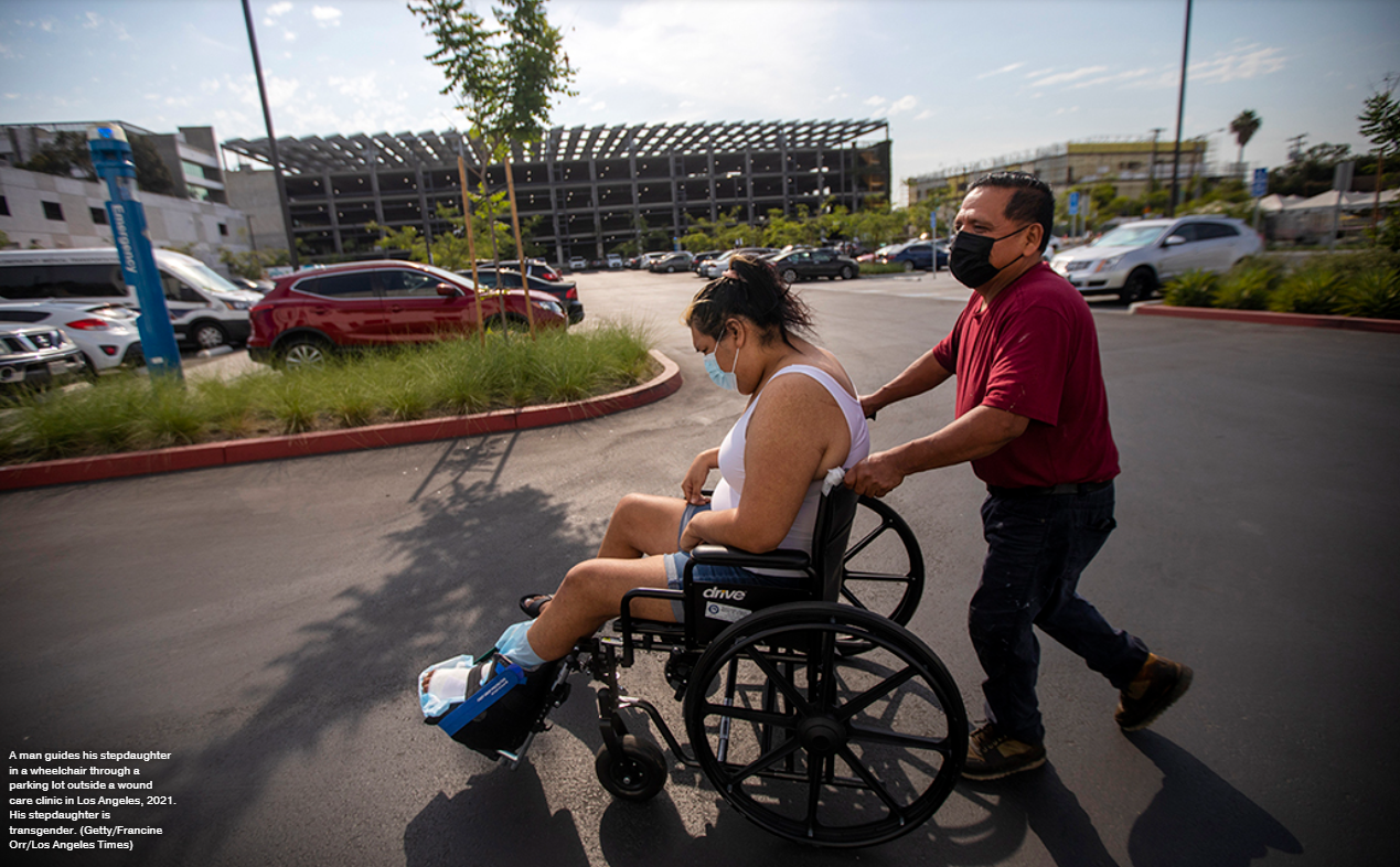 Image of transgender person in a wheelchair leaving a care facility